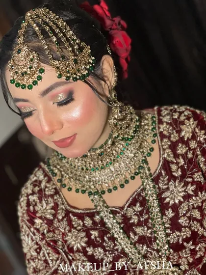 A close-up on the makeup. I used a shimmery eyeshadow to make her eyes pop and a soft lip color that complements the rich tones of her outfit.