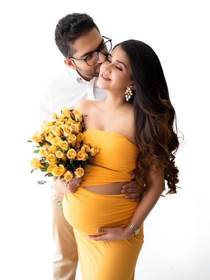 A sweet moment during a baby shower themed shoot. The yellow roses perfectly match the mamma's vibrant dress.