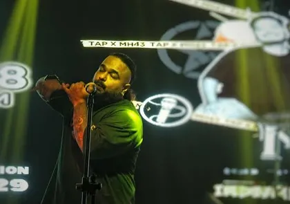 Our frontman owning the stage at TAP Resto Bar. The background visuals and stage presence are all part of the complete entertainment package we deliver.