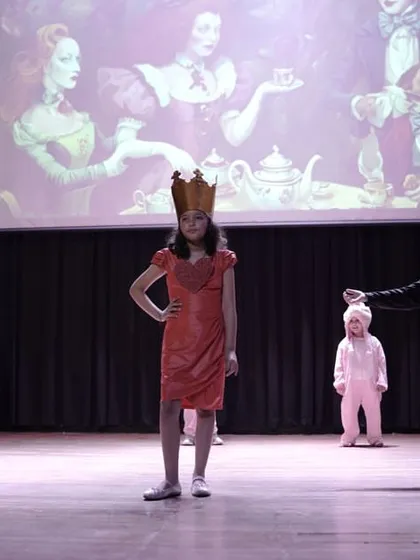The Queen character takes center stage, demonstrating confidence and authority. Every role is an opportunity to build powerful communication skills.
