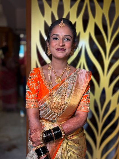 Ready for her forever. This bride's soft smile and elegant posture show her readiness for the big moment, with her makeup and styling perfectly in place.