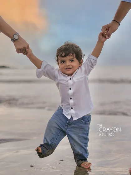 There's nothing like a child's first steps on the sand, held securely by the hands of those who love him most. Our beach photoshoots are all about capturing that sense of freedom, play, and connection against the beautiful backdrop of the Mumbai seaside.