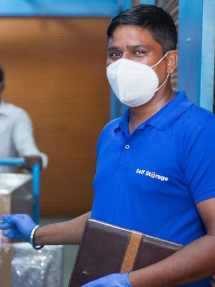 Our professional staff is the backbone of our service. Here, a team member is carefully processing items for storage, showcasing our commitment to security, hygiene, and organized handling of your belongings.