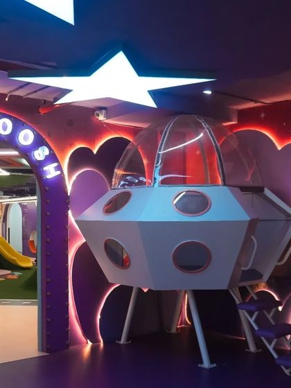 From an empty shell to a vibrant spaceship entrance. This image shows the transformation of our space and the beginning of our journey to build a dream play area.