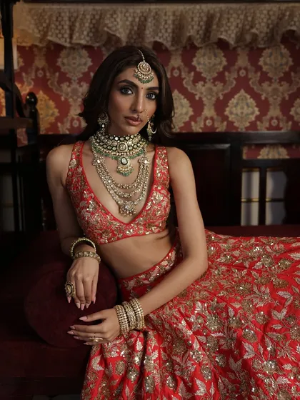 Another shot from this series, focusing on the layered necklaces and the intricate details of the bridal ensemble.