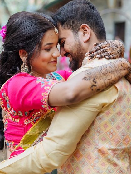 A tender close-up of the couple, their foreheads touching, capturing the intimacy of their connection.