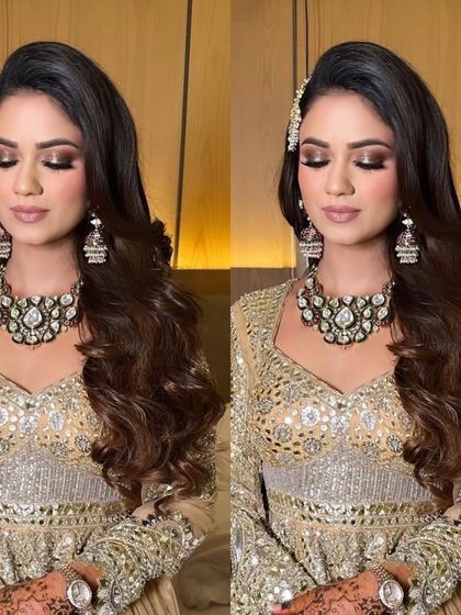 All set for her Sufi night with these gorgeous, soft waves. The side parting and clip add a touch of elegance to the look.