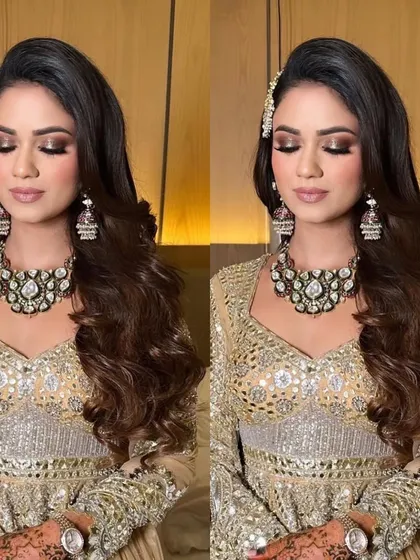 All set for her Sufi night with these gorgeous, soft waves. The side parting and clip add a touch of elegance to the look.