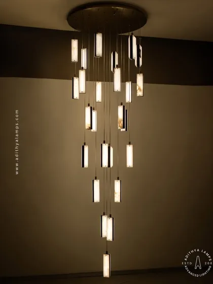 This cascading chandelier, crafted from exquisite marble and fine leather accents, is more than a light fixture; it is a centerpiece of artistry. It is designed for grand spaces like double-height living rooms or entryways, making an unforgettable statement of modern luxury.
