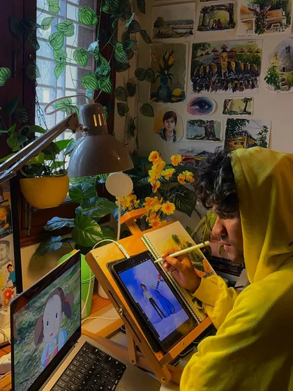 Me in my happy place, working on a digital painting. Surrounded by my art and plants, this is where I feel most creative and at peace.