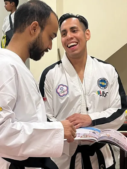 A happy moment with Sabum Carlos Machado as he flips through the pages of the magazine.