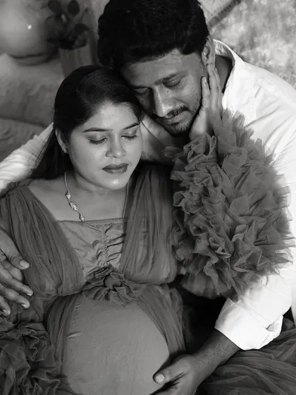 This black and white maternity photo emphasizes the emotion and connection between the couple, creating a timeless and artistic portrait.