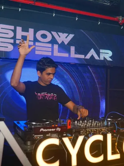 Waving to the crowd at Cyclone during my debut set in the city.