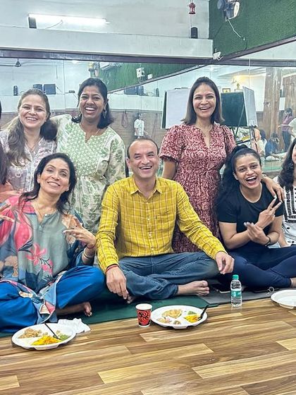 All smiles during our community gathering. These moments of connection are just as important as the time spent on the mat.
