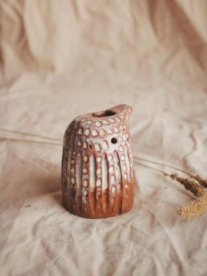 The very first singing pajarito I made. I used a textured red clay and a white glaze that breaks over the dots, creating this rustic, earthy finish.