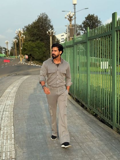 The grey travel co-ord set seen on the move, showcasing its stylish and practical design for the modern traveler.