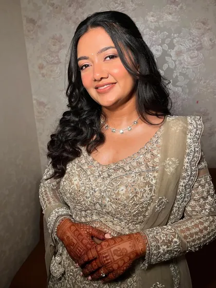 A beautiful portrait showing the minimal yet glowing makeup. The focus is on enhancing her natural beauty and creating a look that feels elevated and fresh.