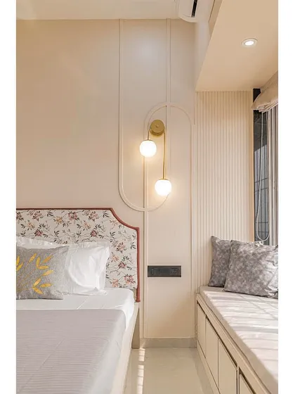 This shot highlights the cozy window seat, providing a comfortable spot for relaxation, and the simple, elegant lines of the wall paneling.