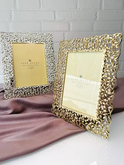Showcase your cherished moments in frames that redefine artistry. Crafted in both gold and silver with intricate orange-peel cutwork, these designs add an understated glow and opulence to your decor.