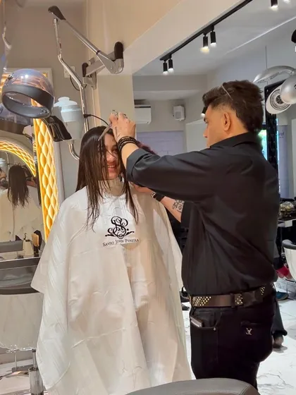 The master at work. Here I am, giving a client a fresh new look at our brand new salon in Thane. Every snip is made with precision and purpose.