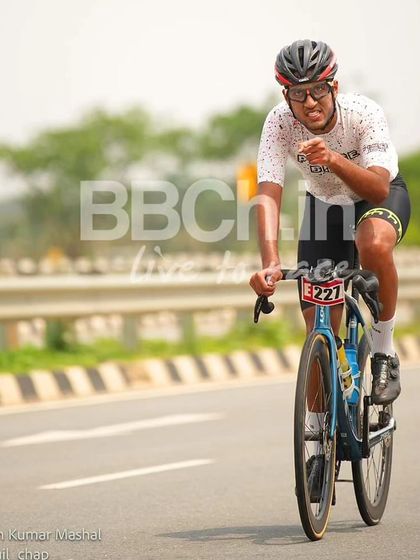 An elite rider, showing the strain and effort of a long and hard race.