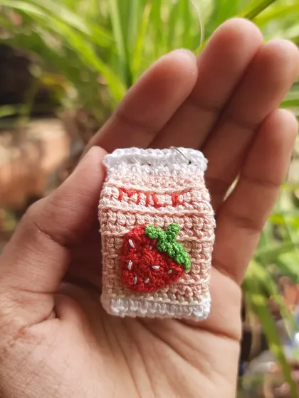 A close-up of the strawberry milk keychain. I was so excited to launch this design, it's one of my personal favorites.