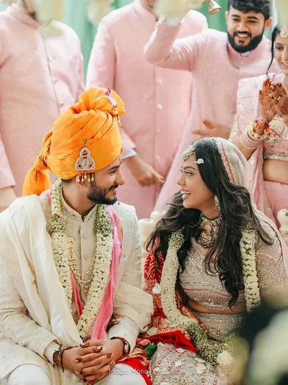 The look they share says it all. A candid moment from the wedding ceremony, where the couple is lost in their own world.