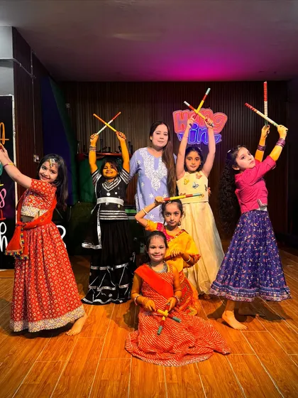 A beautiful moment with our Garba and Dandiya students. This picture captures the colorful costumes, bright smiles, and the wonderful bond between our dancers and their instructor.