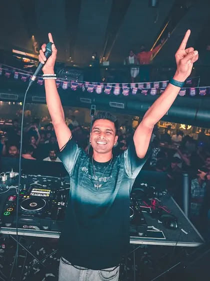The connection with the crowd is everything. This shot from a packed night at FLO captures that moment of shared joy, with hands in the air and a smile that says we're all in this together.