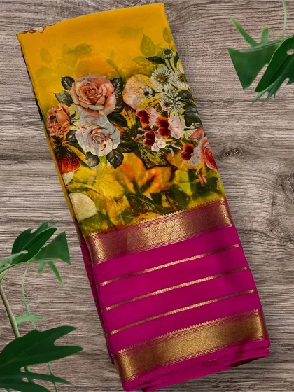 A closer look at the vibrant yellow floral print pure Mysore crepe silk saree with a contrasting rani pink striped border.