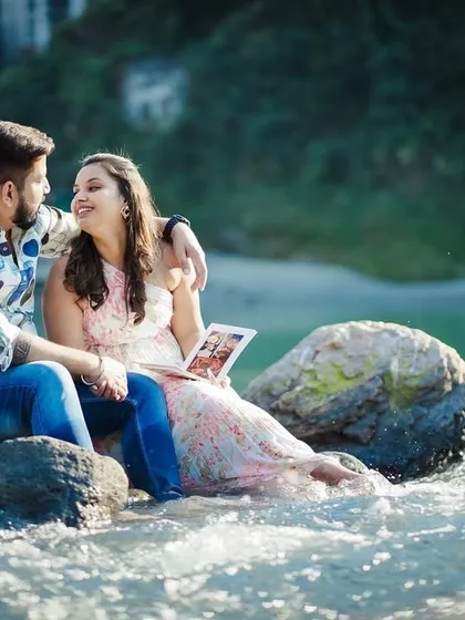 Another angle from the riverside shoot, showing the couple relaxing and enjoying the beautiful scenery.