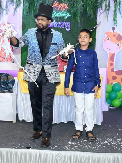 A young volunteer helps me with a classic rope and silk illusion. These interactive moments are perfect for birthday parties, making the birthday child and their friends feel extra special.