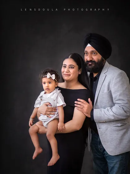 A lovely family portrait with coordinated outfits. The classic posing ensures that this will be a cherished photo for years to come.