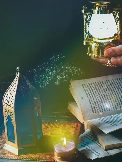 A cozy and mysterious evening scene with a book, candle, and antique lanterns, creating a narrative of quiet contemplation and study.