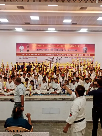 Parents and coaches capturing the moment of victory. The support system behind every player is crucial.