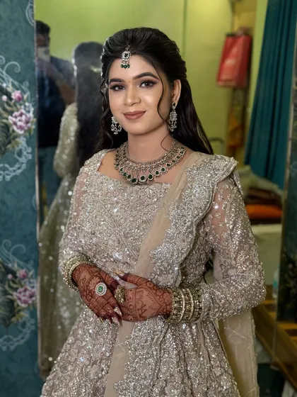 A portrait of the bride, her soft makeup and diamond jewellery completing the look.