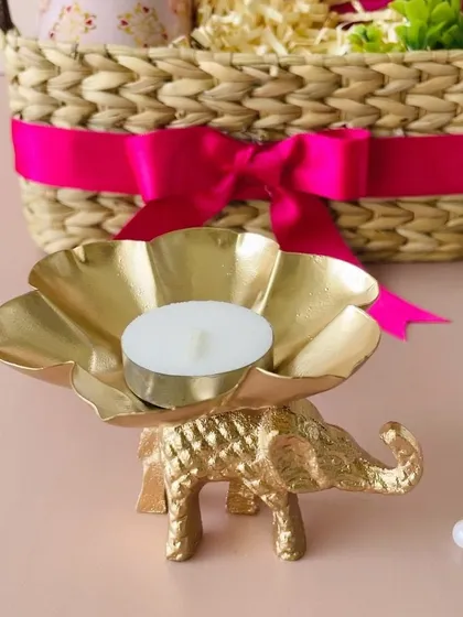 A close-up of the stunning golden elephant T-light holder, which can be included in many of my hamper designs, including this Kauna basket.