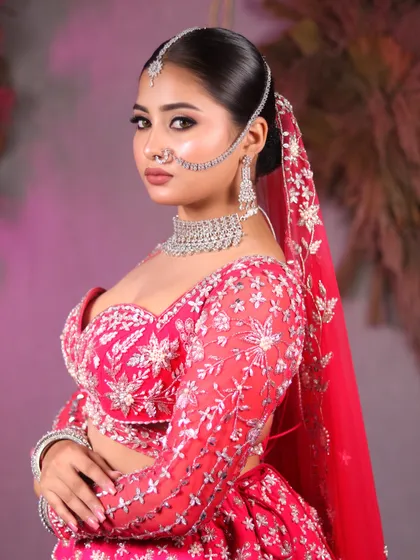 Every bride deserves to feel like a queen. This stunning transformation by our student features a bold eye, soft lips, and a beautiful pink lehenga.