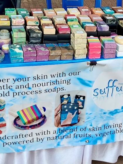 Another view of my market stall, showcasing the wide variety of handmade soaps available. I love seeing them all lined up and ready to find new homes.