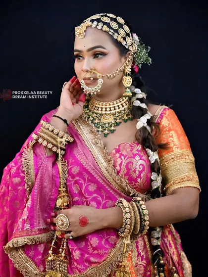 A regal bridal look featuring a long, thick braid adorned with jasmine flowers and a traditional matha patti. This style is a beautiful blend of tradition and elegance, perfect for a queen on her wedding day.