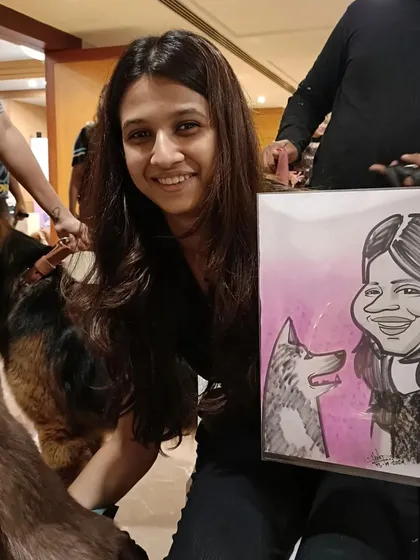 A guest with her husky and their caricature. It was a day filled with furry friends.