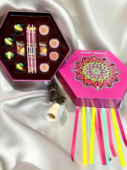 Another view of the hexagonal lantern gift box for Diwali. This one contains an assortment of firecracker-shaped chocolates and comes with a bulb fitting to be used as a lamp.