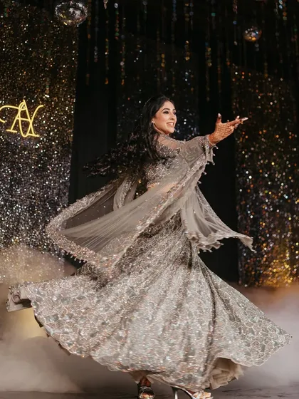 The perfect twirl during a bride's solo. We choreograph routines that not only look beautiful but also feel amazing to perform, especially in a gorgeous lehenga like this.