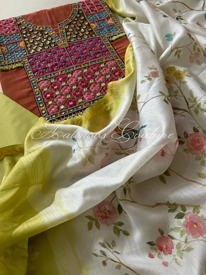 This image highlights the soft, flowing texture of the hand-painted silk chanderi dupatta against the structured cotton of the kurta.