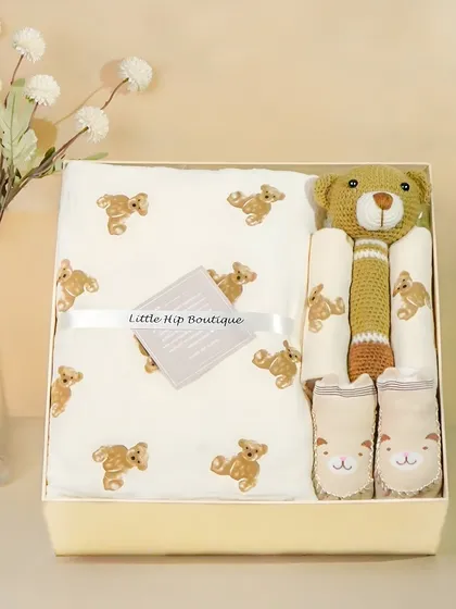 A neutral-toned bear-themed gift box. The elegant styling and soft lighting give this hamper a premium, boutique feel.