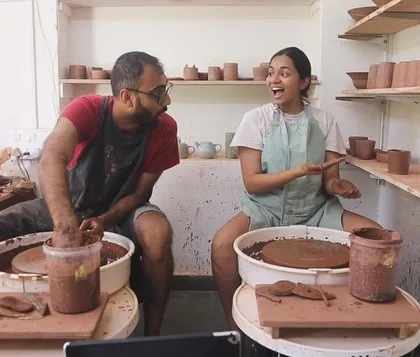 This is us, Mahanth and Shreya, in our happy place. We love the messy, joyful process of creating together, and this photo captures the fun we have bringing our ceramic ideas to life.