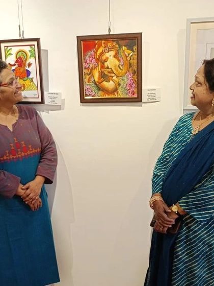 Visitors enjoying my 'Murali Ganesha' painting at the exhibition at IIWC.
