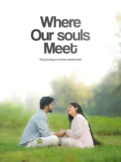 A serene and soulful portrait of a couple sitting in a green field. The text overlay "Where Our Souls Meet" perfectly captures the mood of the image, which is all about deep connection and the start of a shared journey.