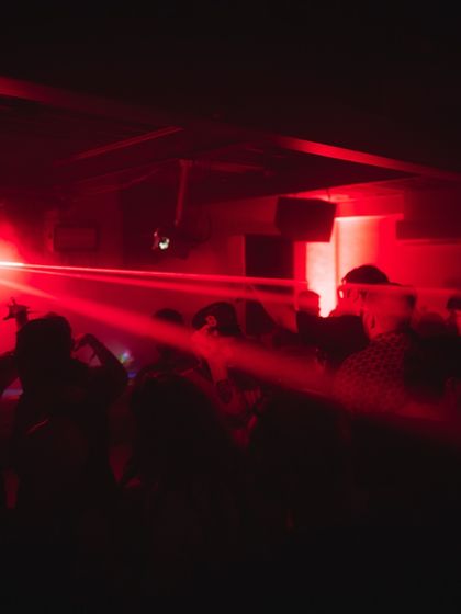 Red lasers cutting through the haze, a signature element of the clubs I love to play. It creates an environment that's both intense and intimate.