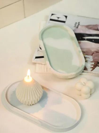 Beyond candles, I also craft these marbled Jesmonite trinket trays. They are water-resistant, fire-proof, and the perfect stylish base for our sculptural candles or your favorite jewelry.